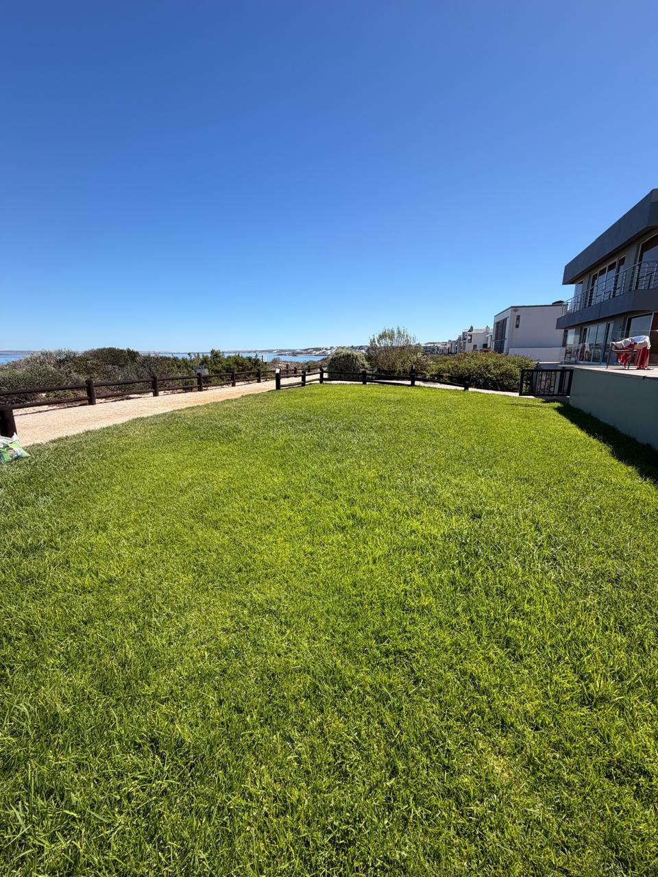 Completed irrigation work with neat lawn finish and installed sprinkler coverage